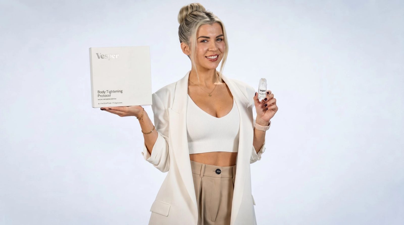 The Vesper Body Tightening Protocol box and micro-infusion applicator, held